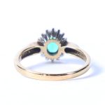 A 9 CARAT GOLD, EMERALD AND DIAMOND RING. 3