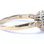 A 9 CARAT GOLD, EMERALD AND DIAMOND RING. 4